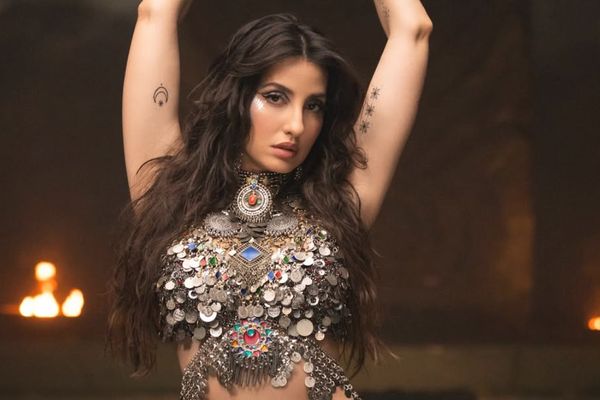 Nora Fatehi’s Body Roll Look Goes Viral: Blue Eyeliner, Tribal Glam & Stunning Photos