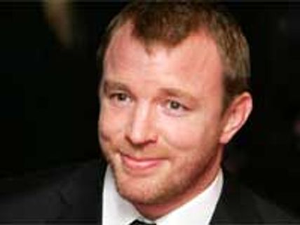 Guy Ritchie gets cozy with sexy blondes