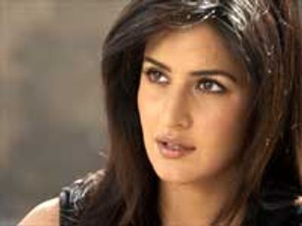 Katrina covers her face with Burkha