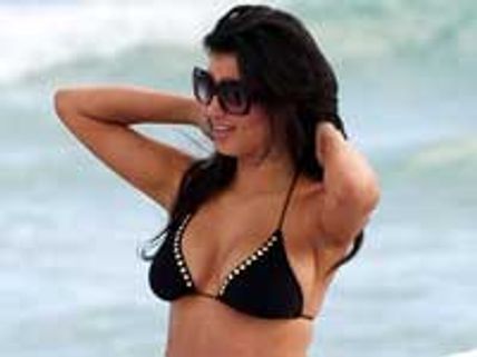 Kourtney Kardashian enjoying her pregnancy curves