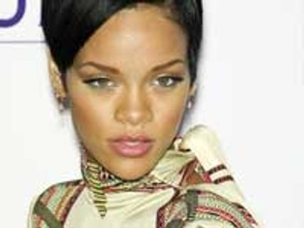 Rihanna tumbles over on stage during London show