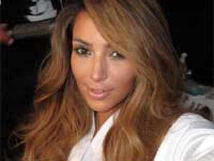 Kim Kardashian bowls in mini-dress