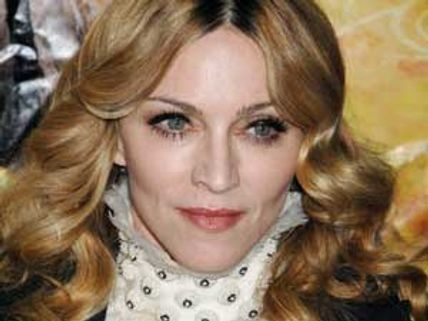 Madonna dazzles in tailed dress at WE première