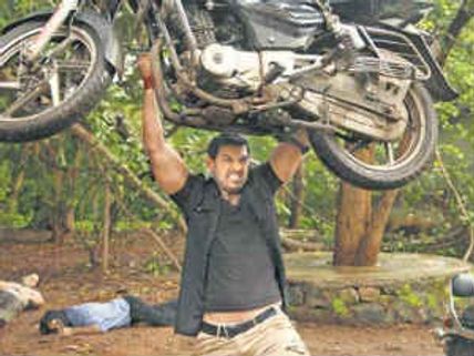 John Abraham lifts 115 kg bike before media