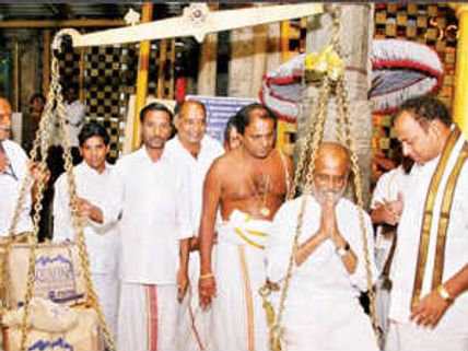 Rajinikanth offers Thulabaram at Tirumala