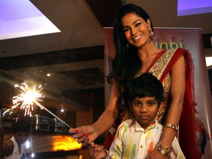 Veena Malik adopts seven year old girl Payal Kamble 