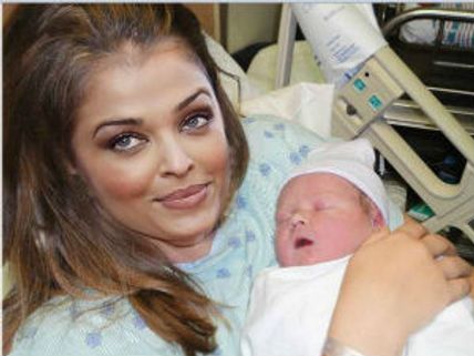 Aishwarya Rai's baby photos are fake: Amitabh-Abhishek