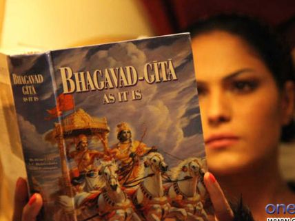 Pics: Veena Malik taking spiritual path; reading Bhagavad Gita