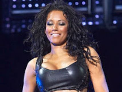 Melanie Brown carries sewing kit on red carpet