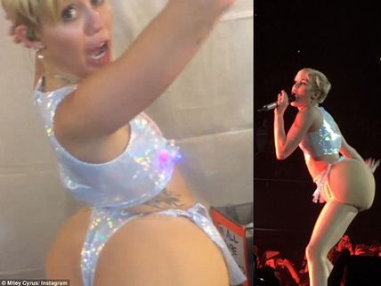 Wild! Miley Cyrus Shows Fake Butt, Spits On Cheering Crowd