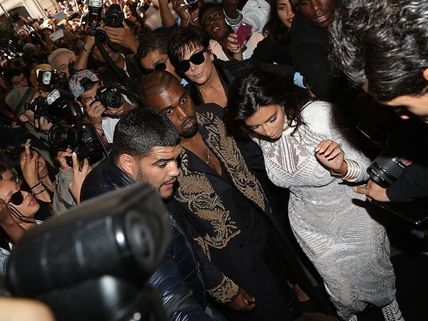 Watch: Kim Kardashian Attacked By Prankster At Paris Fashion Week