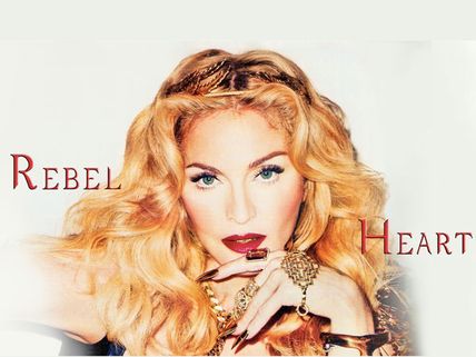 Madonna's Bizarre Antics! Madge Exposes Fan's Bosoms On Stage!