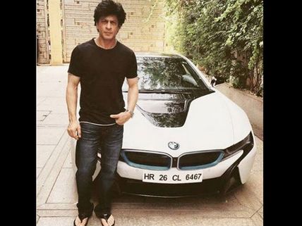 Oh Wow! Shahrukh Khan Poses With His New Car BMW i8; Also See The Luxurious Cars Of Other Celebs!