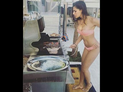 Dangerously HOT! This Picture Of Nargis Fakhri Cooking In A BIKINI Will Make Your Jaw Drop!