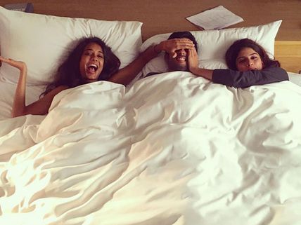 Guess Who Is It? Lisa Haydon & Sapna Pabbi Are In Bed With An Unknown Actor For A Shoot!