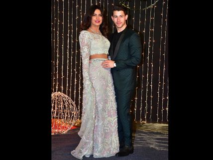 FIRST LOOK: Priyanka Chopra & Nick Jonas Turn Heads At Their Bollywood Reception Party!