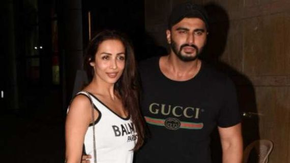 Arjun Kapoor & Malaika Arora Ask Everyone to 'Check Your Privilege'; Share Pic Of Man Worshipping Mumbai Local
