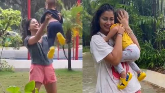 வாவ்.. செம க்யூட்.. குழந்தையுடன்  மழையில் ஆட்டம் போடும் மழை நாயகி!