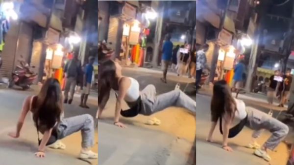 Viral Video: सड़क के बीचोंबीच कैमरा लगाकर ये लड़की करने लगी OYO वाली हरकतें, लोगों ने कहा- 'उल्टी नोरा फतेही'