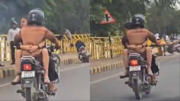 Viral Video: चलती बाइक पर रोमांस करता दिखा कपल, ट्रैफिक नियमों की उड़ाईं धज्जियां