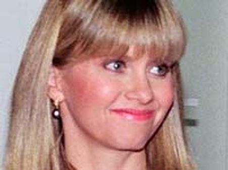 Olivia urges media to respect Travoltas' privacy