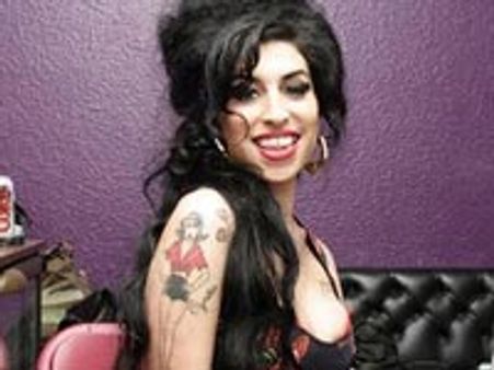 Winehouse desperate to save her marriage