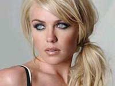 Abbey Clancy exposes her twin assets