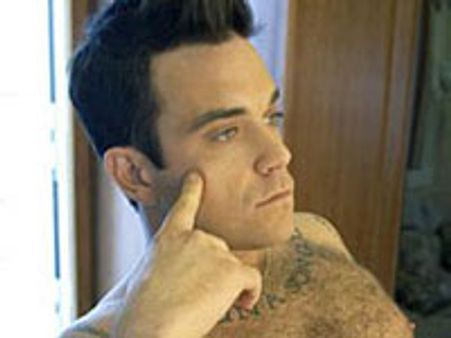Robbie Williams quizzed over armed robbery