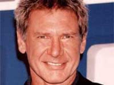 Hotties surprise Harrison Ford with cigars