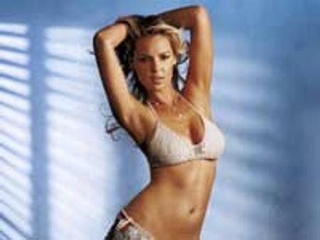 Katherine Heigl tries vibrating pants at home