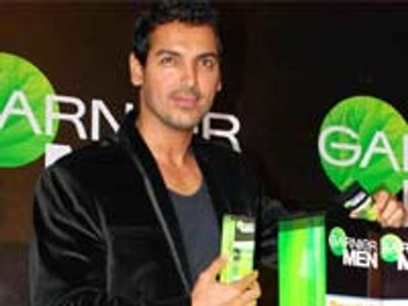 John Abraham signs Jacqueline Fernandez