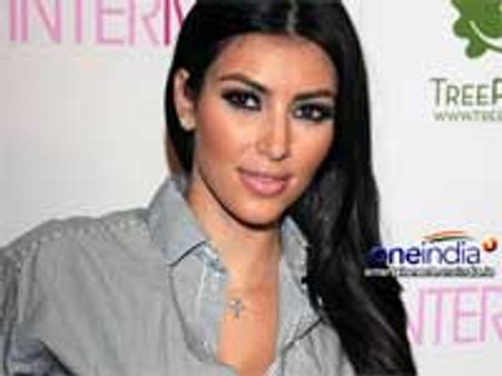 Kim gets her bottom measured for Madame Tussuads