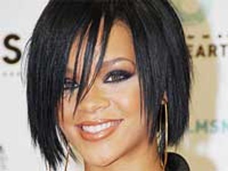 Rihanna unveils pistol tattoo on her thigh