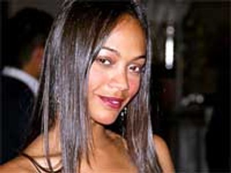 Zoe Saldana strips for Calvin Klein photo shoot