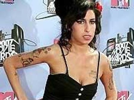 Amy Winehouse caught admiring her boobs in Brazil