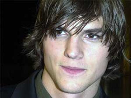 Ashton Kutcher officially signs Two and a Half Men