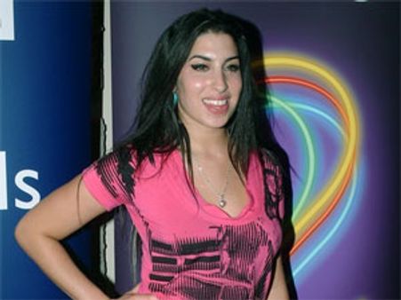 Amy Winehouse secretly engaged to Reg Traviss