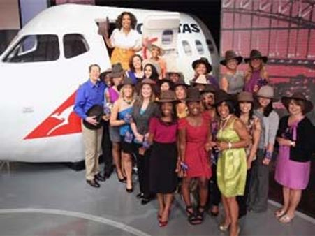 John Travolta flies Oprah & 302 loyal viewers to Australia