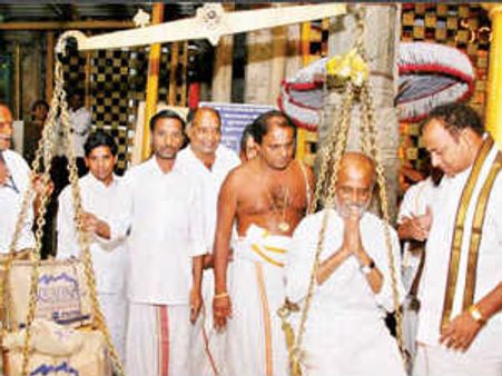Rajinikanth offers Thulabaram at Tirumala