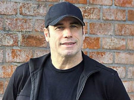 John Travolta denies sexually assaulting masseur
