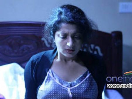 Meera Jasmine playing Miss Tharoor in MLTK