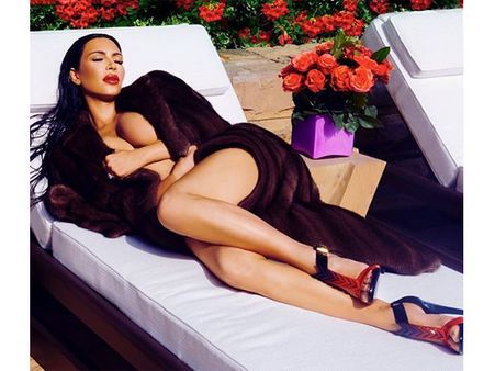 Pregnant Kim Kardashian Wears Only A Fur Coat For Her Website Shoot