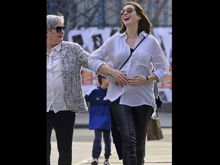 Anne Hathaway & Chrissy Teigen Show Off Their Baby Bumps