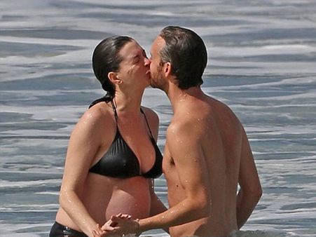 Anne Hathaway Shows Off Her Baby Bump In A Bikini While Sharing A Kiss With Husband Adam!