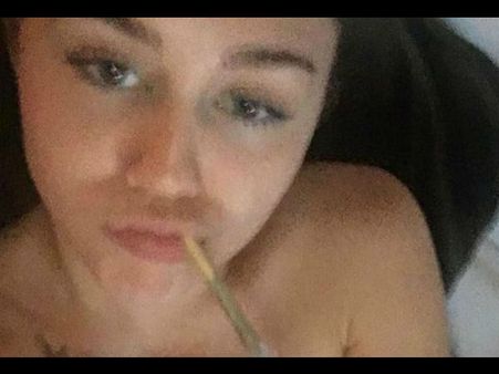 Miley Cyrus Shares A Topless Selfie While Smoking Weed Amidst Pregnancy Rumours!