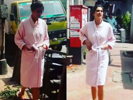 Onlookers Stunned: Nargis Fakhri Wears A Bathrobe & Walks Around Mumbai City!