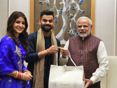 THREE ICONS IN ONE FRAME! Anushka Sharma & Virat Kohli Invite PM Narendra Modi For Their Reception!