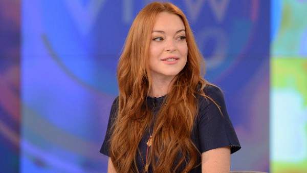 Lindsay Lohan Teases New Music, Says 'I'm Back'