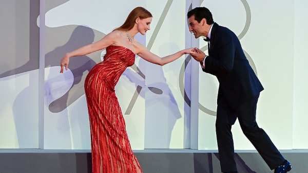 Jessica Chastain Responses To Viral Red Carpet Moment With Oscar Isaac; Shares A Still From The Addams Family