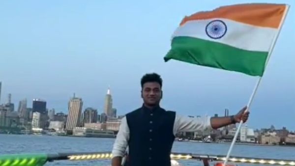 Rockstar DSP's Year of Pride and Patriotism As He Stands Tall Holding The National Flag